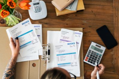Female with accounting work on desk
